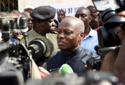 FILE - Guinea-Bissau's president Jose Mario Vaz speaks to media at a polling station in Bissau, March 10, 2019, during the legislative elections.