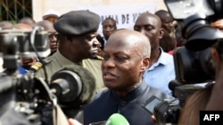 FILE - Guinea Bissau's president Jose Mario Vaz speaks to media at a polling station in Bissau, March 10, 2019, during the legislative elections in Guinea Bissau.