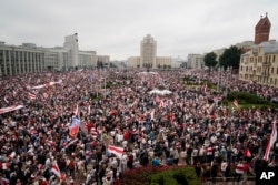 FILE - Belarusian opposition supporters rally in Minsk, Belarus, on Aug. 23, 2020, after President Alexander Lukashenko's disputed reelection victory. In a subsequent crackdown, hundreds of independent media outlets and nongovernmental organizations were closed and outlawed.
