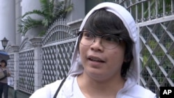 Jeanne Vivar, a student, is interviewed by the Associated Press, Nov. 2, 2017, about President Donald Trump's visit to Asia in Manila, Philippines.