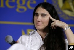 FILE - Cuban blogger Yoani Sanchez speaks at the Freedom Tower of Miami Dade College, in Miami, Florida, April 1, 2013