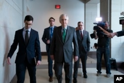 Senate Majority Leader Mitch McConnell, R-Ky., passes reporters as he and other congressional leaders head to a classified briefing on Iran after members of both parties asked for more information on the White House's claims of rising threats in the Middle East, at the Capitol in Washington, May 16, 2019. President Donald Trump said at the time that he hoped the U.S. was not a path to war with Iran, following a series of administration statements and actions that alarmed American allies.