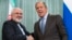 FILE - Iranian Foreign Minister Mohammad Javad Zarif (L) and Russian Foreign Minister Sergei Lavrov are seen shaking hands.