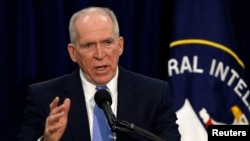 FILE - Director of the Central Intelligence Agency (CIA) John Brennan talks to the press during a rare news conference at CIA headquarters in Virginia, Dec. 11, 2014. 