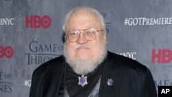 FILE - George R. R. Martin, pictured in 2014 at HBO's "Game of Thrones" fourth-season premiere in New York.