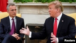 U.S. President Donald Trump speaks while meeting with NATO Secretary General Jens Stoltenberg in the Oval Office at the White House in Washington, April 2, 2019.