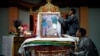 Tibetans arrange a portrait of the Dalai Lama during a function organized to mark his 82nd birthday in Lalitpur, Nepal, July 6, 2017. 