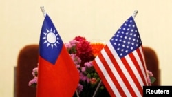FILE - Flags of Taiwan and US in place for a meeting between US and Taiwan legislators in Taipei, Taiwan March 27, 2018.