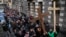 FILE - Syrian Christians carry crosses and shout slogans in Damascus, Syria, Dec. 24, 2024, as they march during a protest after a Christmas tree was set on fire in Hamah city.