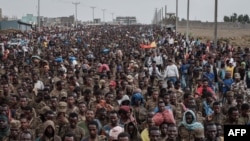 Captive Ethiopian soldiers walk towards the Mekele Rehabilitation Center in Mekele, the capital of Tigray region, Ethiopia, on July 2, 2021. 