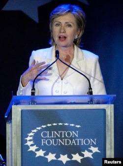 FILE - Then-Senator Hillary Clinton, wife of former U.S. President Bill Clinton, speaks at a fund raising gala for the Clinton Foundation in New York, Oct. 28, 2006.
