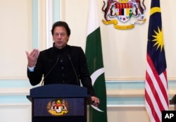 FILE - Pakistan's Prime Minister Imran Khan speaks during a press conference in Putrajaya, Malaysia, Nov. 21, 2018.