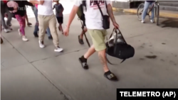 A undated video screenshot shows migrants passing through Paso Canoas, Panama, on their way back to their home countries from the U.S., Feb. 11-13, 2025.