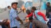 Protesters construct a burning roadblock in Kinshasa, Congo, Monday Jan. 21, 2019. Congo’s police dispersed a gathering Monday of supporters waiting to hear a speech by presidential runner-up Martin Fayulu, his spokeswoman said.