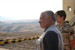 FILE - Jordan’s King Abdullah II tours the Baqura enclave, formerly leased by Israel, Nov. 11, 2019.