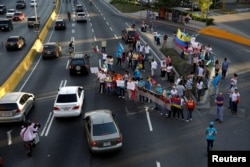 Opposition supporters block a highway during a protest against Venezuelan President Nicolas Maduro's government, in Caracas, March 30, 2017.