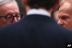 European Commission President Jean-Claude Juncker (L), and European Council President Donald Tusk (R) speak with Austrian Chancellor Sebastian Kurz during a round table meeting at an EU summit in Brussels, Dec. 14, 2018.