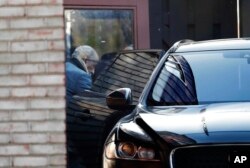 Rep. John Conyers, D-Mich., leaves his home in Detroit, Nov. 29, 2017. Conyers is being pressured by some in Washington to resign. He recently stepped down from his post as top Democrat on the House Judiciary Committee after facing allegations of sexual harassment by former staffers.