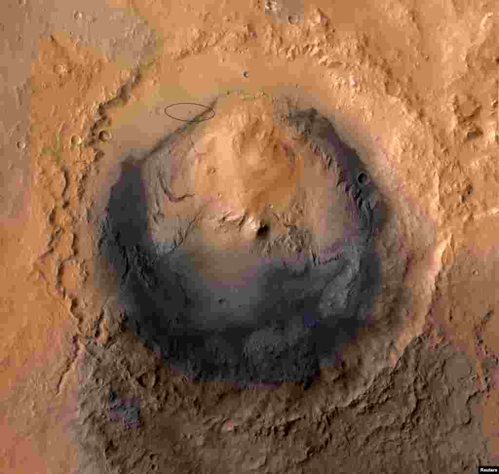 The target landing area for NASA' Mars Science Laboratory mission is the ellipse marked on this image of Gale Crater on Mars (top L).