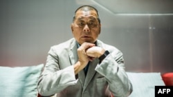 FILE - In this picture taken on June 16, 2020, media tycoon Jimmy Lai poses during an interview with Agence France-Presse at the Next Digital offices in Hong Kong.