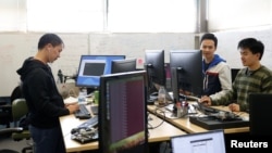 A group of engineers with Airspace Systems work on the software to be used on the company's Interceptor autonomous aerial drone to capture enemy drones in San Leandro, California, March 6, 2017.