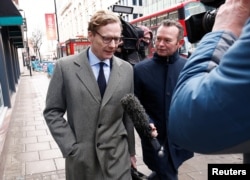 FILE - Alexander Nix, CEO of Cambridge Analytica, arrives at the offices of Cambridge Analytica in London, March 20, 2018.