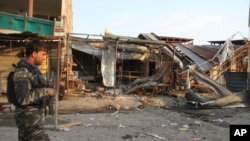 Afghan security personnel arrive at a suicide attack in Jalalabad east of Kabul, Afghanistan, Oct. 25, 2019. The Taliban claimed the attack.