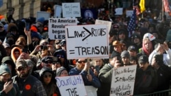 FILE - Gun-rights supporters demonstrate in front of the Capitol in Richmond, Va., Jan. 20, 2020.