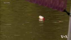 Picking Up Litter in Boat Made From Plastic Litter