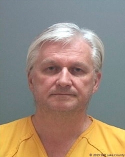 This photo released by the Salt Lake County Sheriff's Office shows Ron Rockwell Hansen, a former U.S. intelligence officer who pleaded guilty to trying to sell secrets to China.