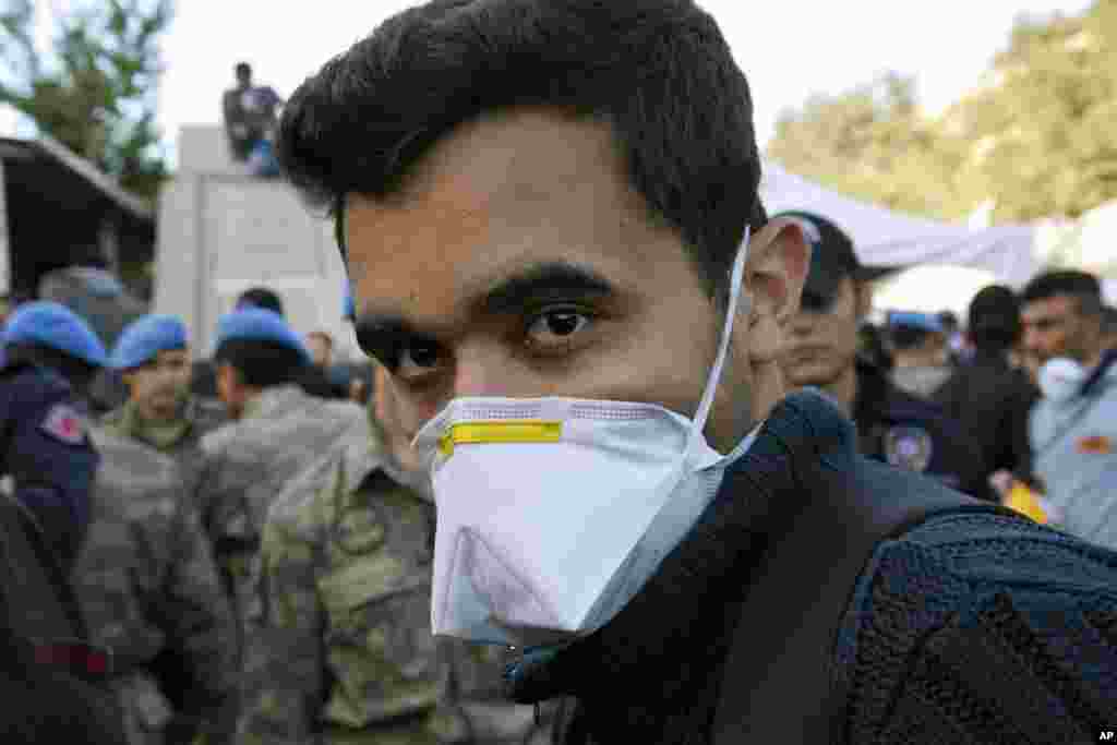 A young man waits outside the coal mine in Soma, May 15, 2014.