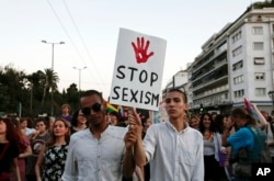 Protesters hold a banner during an annual gay-pride parade in Athens, Greece, June 11, 2016.