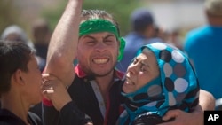 Palestinians mourn the death of Saed Dawabsheh, 32, during his funeral procession in the West Bank village of Duma near Nablus, Aug. 8, 2015. He was the father of a Palestinian toddler killed in a July 31 firebomb attack blamed on Jewish extremists.