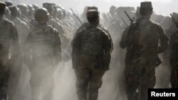 FILE - Afghan National Army (ANA) officers march during a training exercise at the Kabul Military Training Centre in Afghanistan, Oct. 7, 2015.