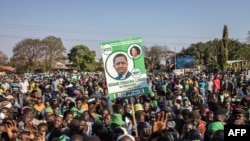 Supporters of the leader of the ruling Zambia Patriotic Front, incumbent president and candidate Edgar Lungu gather in Lusaka, on Aug. 11, 2021 for a virtual closing rally ahead of the general election.