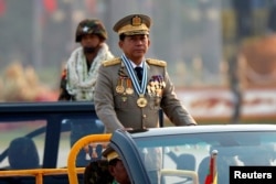 FILE - Myanmar's Senior General Min Aung Hlaing takes part during a parade to mark the 72nd Armed Forces Day in the capital Naypyitaw, Myanmar, March 27, 2017.