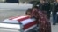 FILE - In this frame from video, Myeshia Johnson cries over the casket in Miami, Florida, Oct. 17, 2017, of her husband, Sgt. La David Johnson, who was killed in an ambush in Niger. 