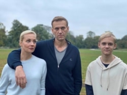 Russian opposition politician Alexei Navalny, his wife, Yulia, and son, Zahar, pose for a picture in Berlin, in this undated image obtained from social media October 6, 2020. (Courtesy of Instagram @NAVALNY/Social Media)