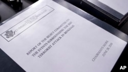 The final report on the 2012 attacks on the U.S. consulate in Benghazi, Libya, where a violent mob killed four Americans, including Ambassador Christopher Stevens, rest on a podium on Capitol Hill in Washington, June 28, 2016. 