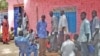 South Sudanese returnees wait to pick up free national ID cards at Apada camp near Aweil in Northern Bahr el Ghazal on Tuesday, March 26, 2013. 