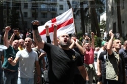 Anti-LGBT protesters shout as they take part in a rally ahead of the planned March for Dignity during Pride Week in Tbilisi, Georgia, July 5, 2021.