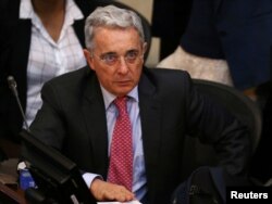 FILE - Senator Alvaro Uribe, Colombia's former president, attends a debate at the congress in Bogota, Colombia, Oct. 3, 2016.
