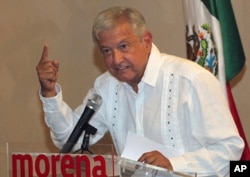 FILE - Presidential hopeful Andres Manuel Lopez Obrador gives a press conference in Mexico City, June 9, 2017.