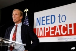 FILE - Billionaire investor and Democratic activist Tom Steyer speaks during a news conference where he announced his decision not to seek the 2020 Democratic presidential nomination, at the Statehouse in Des Moines, Iowa, Jan. 9, 2019.