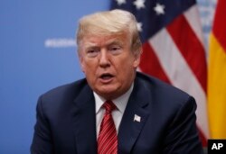 President Donald Trump speaks to media at the G-20 summit, in Buenos Aires, Argentina, Dec. 1, 2018.