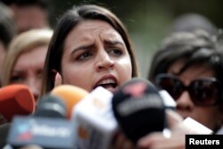 Soley Zambrano, daughter of Edgar Zambrano, National Assembly vice president, speaks during a news conference outside the 'El Helicoide', a detention center of the Bolivarian National Intelligence Service, where her father is under arrest in Caracas, May 9, 2019.