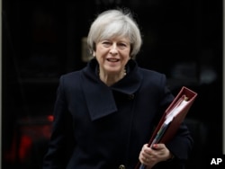 British Prime Minister Theresa May leaves 10 Downing Street in London, Feb. 1, 2017.