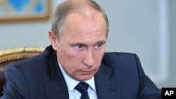Russian President Vladimir Putin says Snowden needs to stop talking about U.S. intelligence.