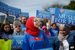 FILE - Protesters stand across the street from a Donald Trump rally in Orlando, Florida.