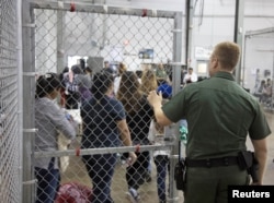 A view of inside U.S. Customs and Border Protection (CBP) detention facility shows detainees inside fenced areas at Rio Grande Valley Centralized Processing Center in Rio Grande City, Texas, June 17, 2018.